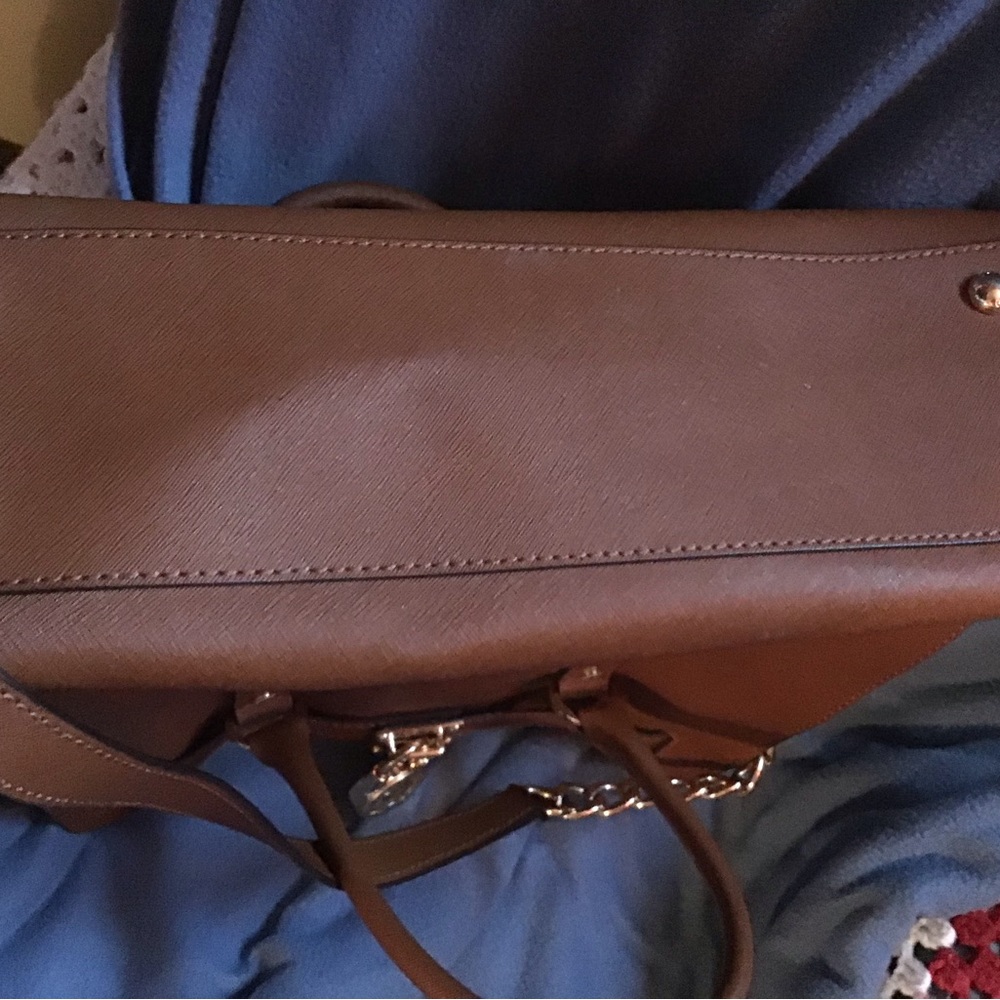 Used just a few times. Excellent condition. Dust cover.  Beautiful bag.